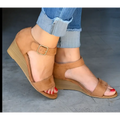 Tan suede wedge buckle strap sandals with gold-toned buckle and wooden-textured heel for plus size fashion wedge buckle