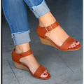 Tan suede wedge buckle strap plus size sandals with a gold-toned buckle and wooden textured heel fashion wedge buckle