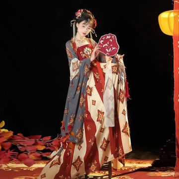 A woman wears a tang imperial han recovery dress han chinese clothing with layered cream red blue floral embroidery