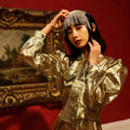 Shimmering gold metallic blouse with puffed sleeves and structured collar paired with tassel diamond pearl bridal headband set