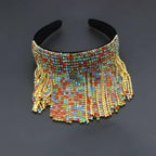 A vibrant tassel diamond pearl bridal headband set with multi-colored beads, gold-toned crystals, and rainbow rhinestones