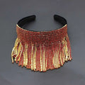 A glamorous red and gold beaded tassel diamond pearl bridal headband set with cascading fringe detail