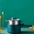 Teal compact multifunctional electric cooking pot with dual-layer silver body, glass lid, blue handles, and black control knob
