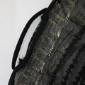 Black lace bag with gold floral thread embroidery complementing the teal gold embroidered dress kraft abaya ensemble