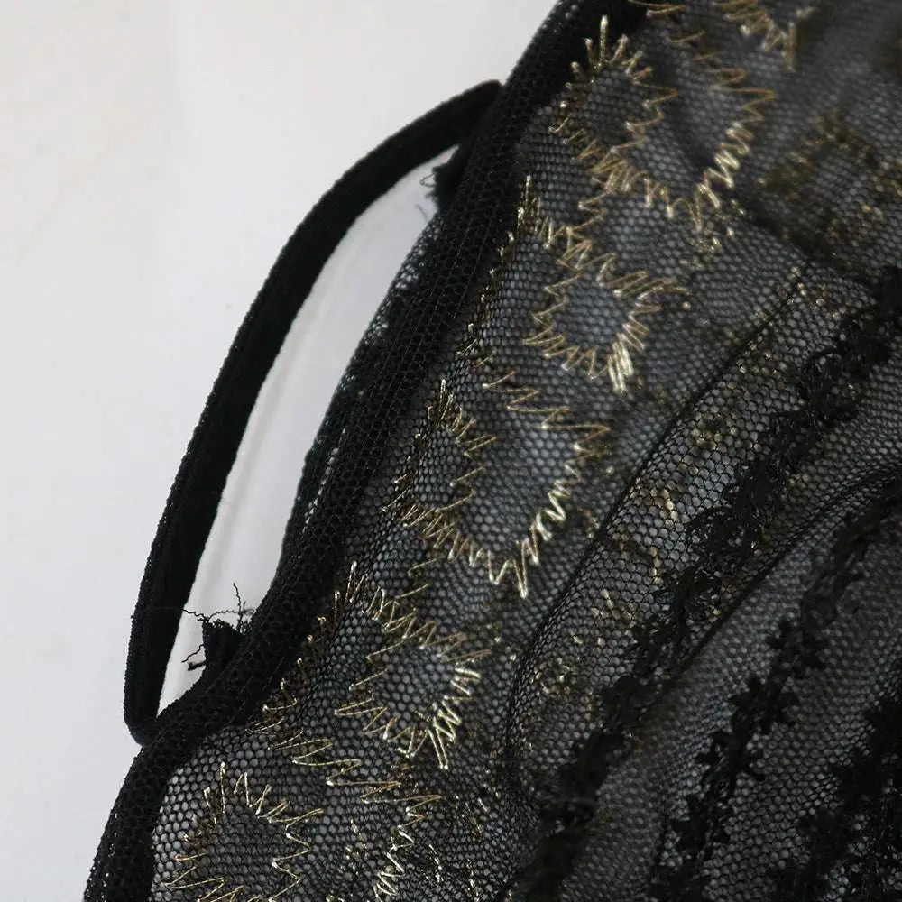 Black lace bag with gold floral thread embroidery complementing the teal gold embroidered dress kraft abaya ensemble