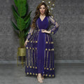 A woman wears a deep purple dress kraft abaya with teal gold embroidered floral and geometric lace overlay designs