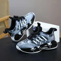 Gray and black adidas dual network sdx shoes rotating button featuring translucent wave design and white stripes