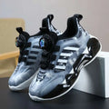Gray and black athletic gradient shoes rotating button with translucent upper and dual network sdx lacing mechanisms