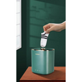 Teal mini portable washing machine with gold-trimmed edges and minimalist design for efficient mini portable use