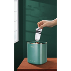 Teal mini portable washing machine with gold-trimmed edges and minimalist design for efficient mini portable use