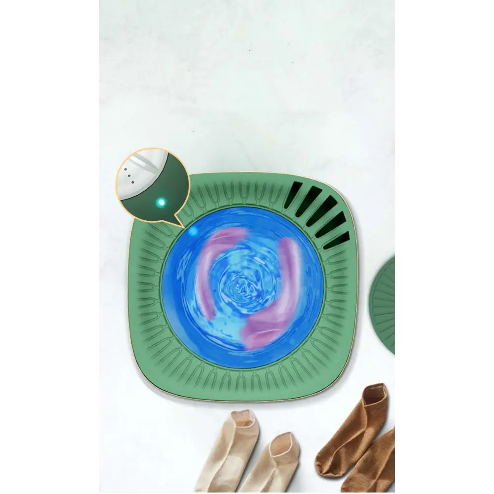 Teal mini portable washing machine with a green square body, blue swirling liquid center, and black edge slits for efficient mini portable use