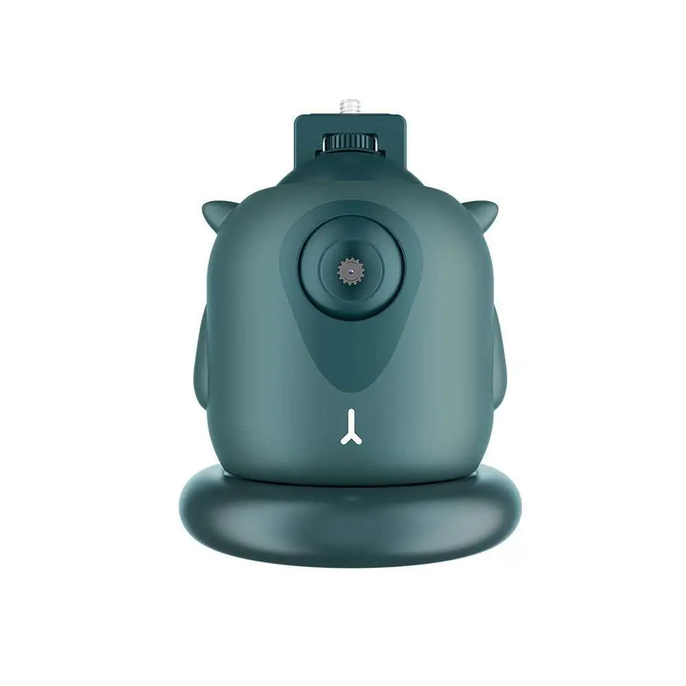 Teal owl-shaped camera with matte finish and small ears featuring gimbal AI face recognition and intelligent follow-up tracking