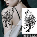 Black and white floral waterproof temporary tattoo featuring a howling wolf, rose, and flying birds by teal phoenix