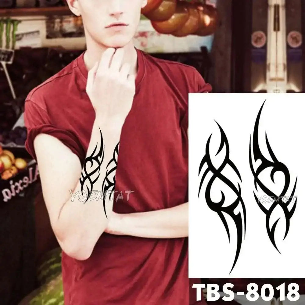 A vibrant teal phoenix and floral waterproof temporary tattoo with delicate pink accents for temporary body art application
