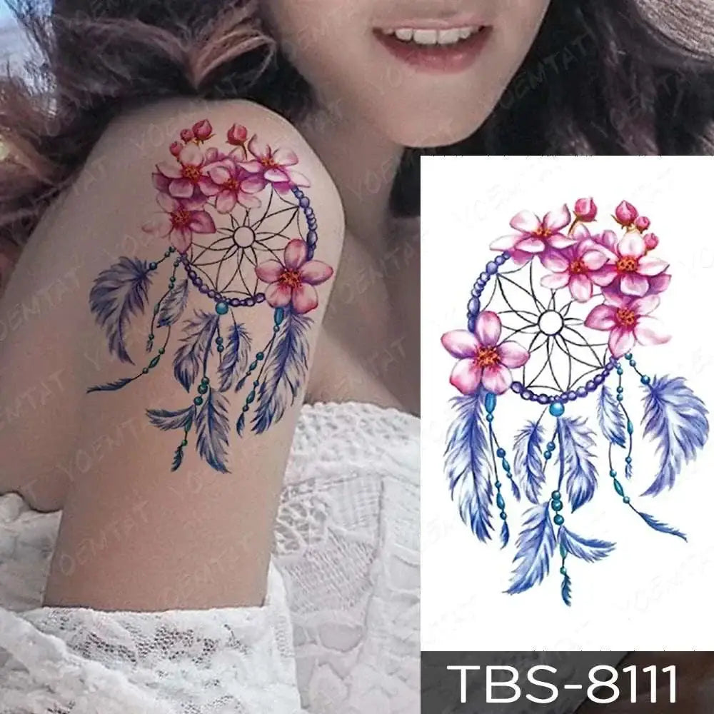 Teal phoenix floral waterproof temporary tattoo featuring a dreamcatcher with pink cherry blossoms and blue feathers