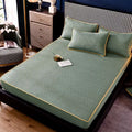 Teal quilted thickened all-inclusive dust-proof single-piece fitted bed pad in soft mint green with geometric pattern and gold trim