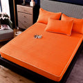 Bright orange quilted thickened all-inclusive dust-proof single-piece fitted bed pad with matching pillowcases
