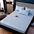 Light blue quilted mattress protector with subtle geometric pattern for thickened all-inclusive dust-proof single-piece fitted use