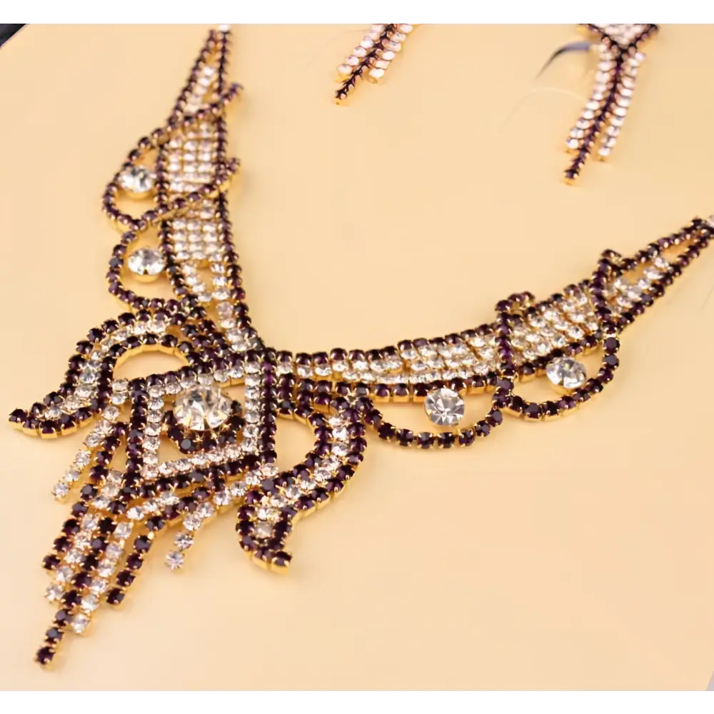 Gold-toned rhinestone american exaggerated butterfly jewelry set with clear and deep purple rhinestones necklace