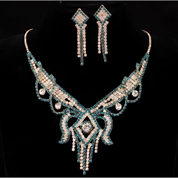 A teal rhinestone american exaggerated butterfly jewelry set featuring a silver necklace with diamond centerpiece and matching earrings