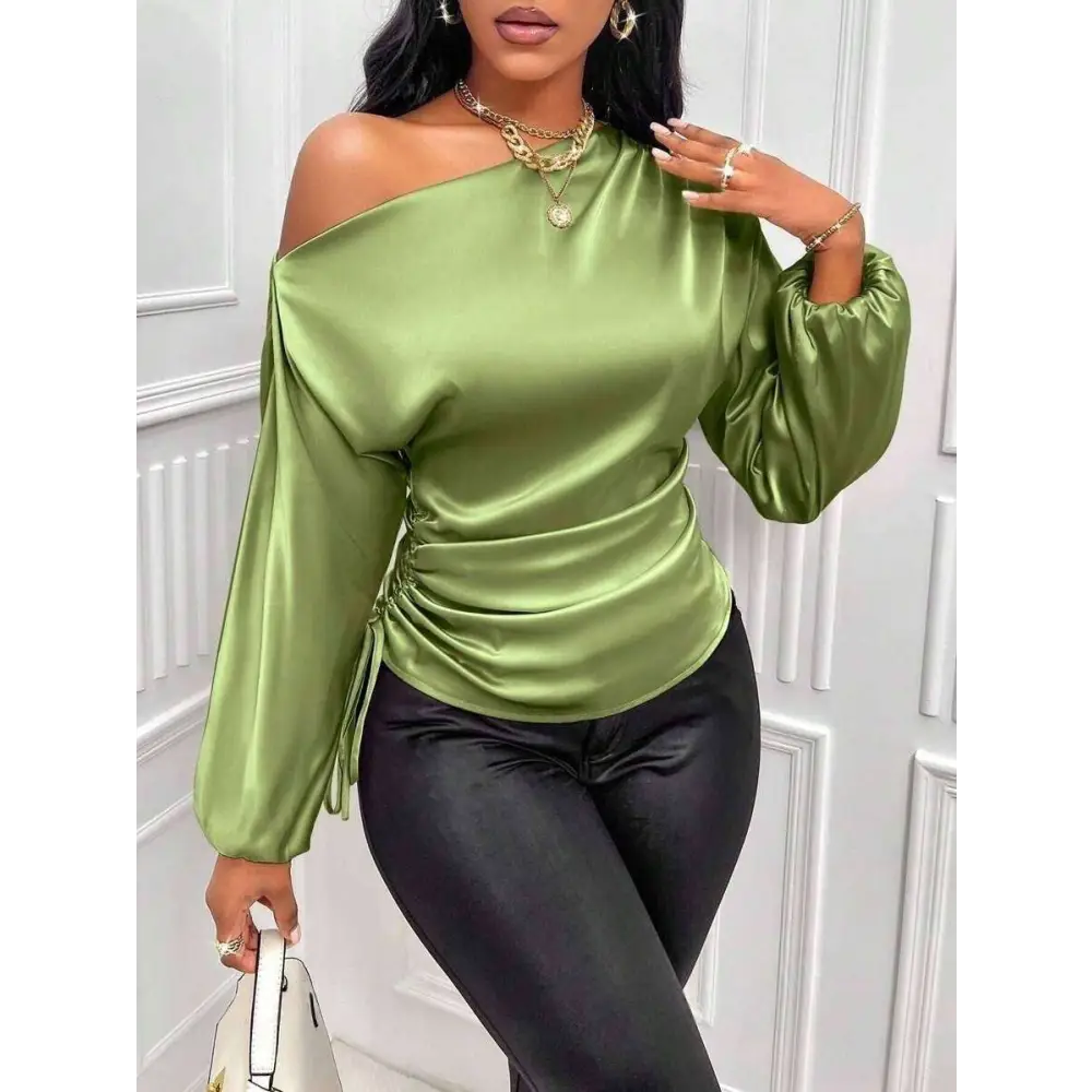 A sleek olive green satin shirt asymmetric top with ruched waist detailing and one-shoulder design