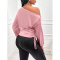 Soft pink satin off the shoulder top with long sleeves and tied ruched waist complementing a teal satin shirt asymmetric style