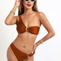A stylish rust-colored split sexy bikini one-piece with ruched nylon starlight fabric and gold rings accents