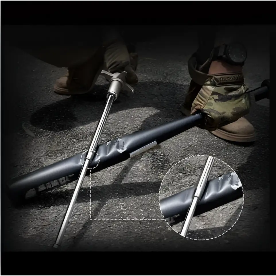 Black and silver telescopic self-defense anti-cut stick with textured grip and reinforced stitching by Royale Essence Lux