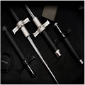 Black and silver telescopic self-defense anti-cut stick with textured grips and metallic accents by royale essence lux