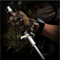 A telescopic self-defense anti-cut stick with a metallic silver body and black grip held in gloved hands by royale essence lux