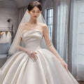 Temperament princess style ivory satin wedding gown in french satin with strapless sweetheart neckline and sheer lace gloves