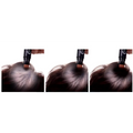 Black cylindrical color dye stick with a brown tip applied to gray hair for temporary brown hair coverage
