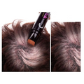 Black cylindrical temporary brown hair color dye stick with orange tip and korean text on label