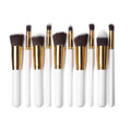 Ten piece makeup brush set with white and gold handles dark brown bristles and maroon case beauty complete kit