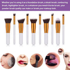 Set of eight makeup brushes with white handles gold ferrules and black bristles from a ten piece makeup brush set with maroon case