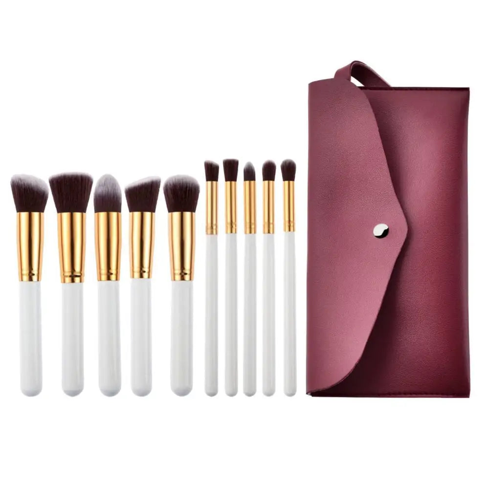 Ten piece makeup brush set with white handles gold ferrules dark brown bristles and a maroon case beauty complete kit