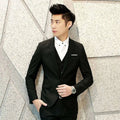 Black men’s suit three-piece with textured tailored fit and subtle white pocket square for formal occasions