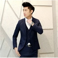 Navy blue tailored men’s suit three-piece with matching vest and trousers in textured black tailored style