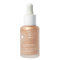 A sleek transparent glass bottle with white dropper cap contains pale peach impossible glow glow hyaluronic acid and sea kelp drops