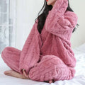 Pink plush knit pajama set with thickened coral velvet and textured cable-knit pattern for winter comfort