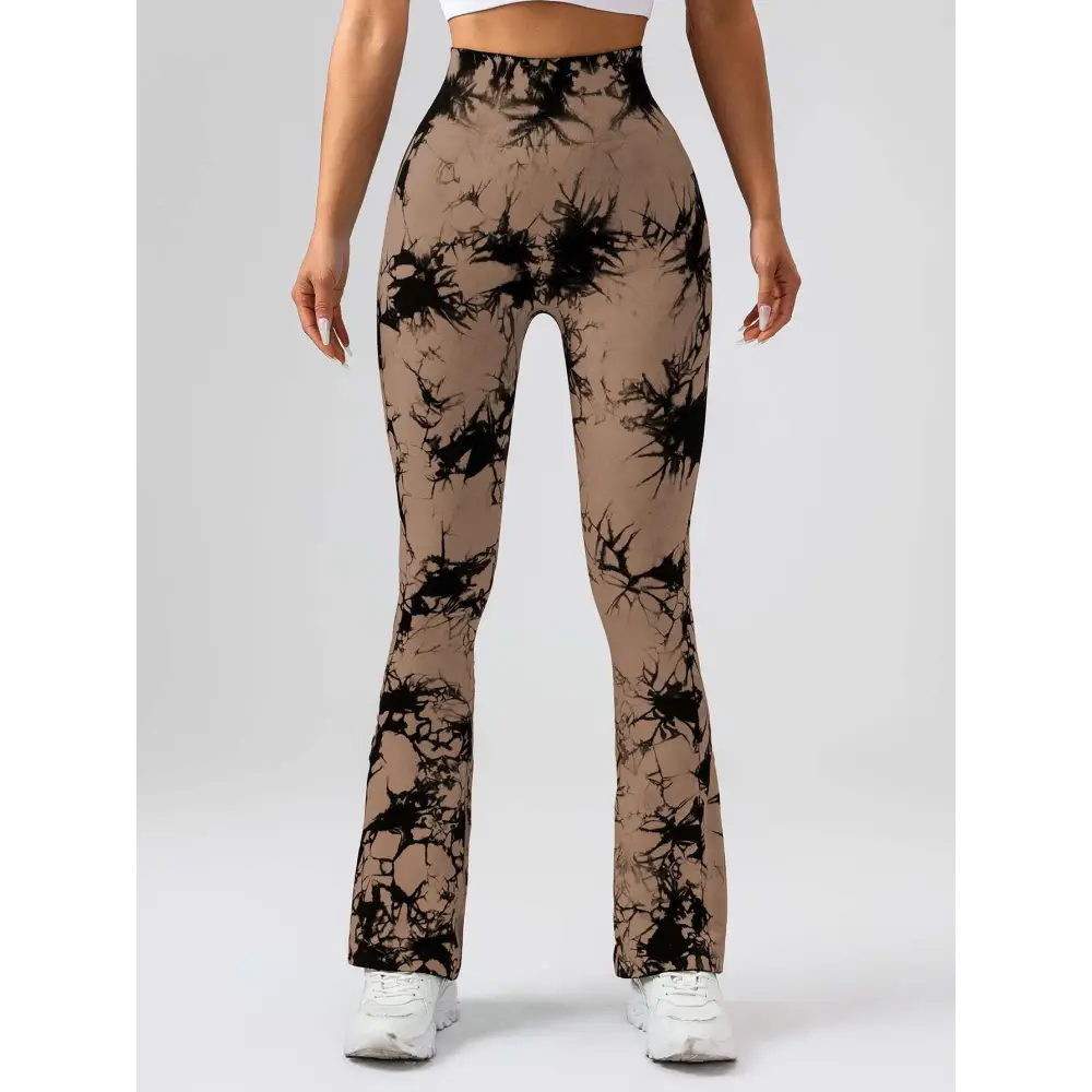 Tan and black tie dye tummy control flare yoga pants with high waist and butt lift design for activewear use