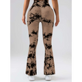 Back view of tan and black tie dye tummy control flare yoga pants with mesh panel and butt lift design