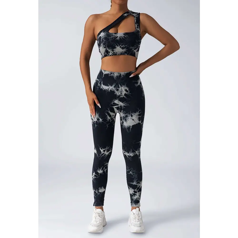 Black and white tie dye women’s scrunch butt yoga set with one-shoulder crop top and high-waisted leggings