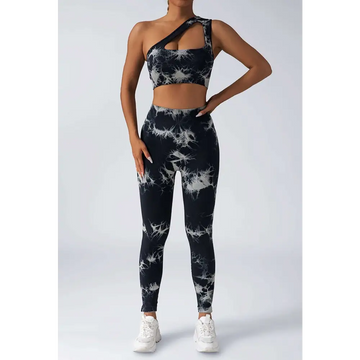 Black and white tie dye women’s scrunch butt yoga set with one-shoulder crop top and high-waisted leggings