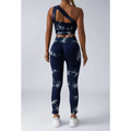 Navy blue and white tie dye women’s scrunch butt yoga set featuring a one-shoulder crop top and high-waisted leggings