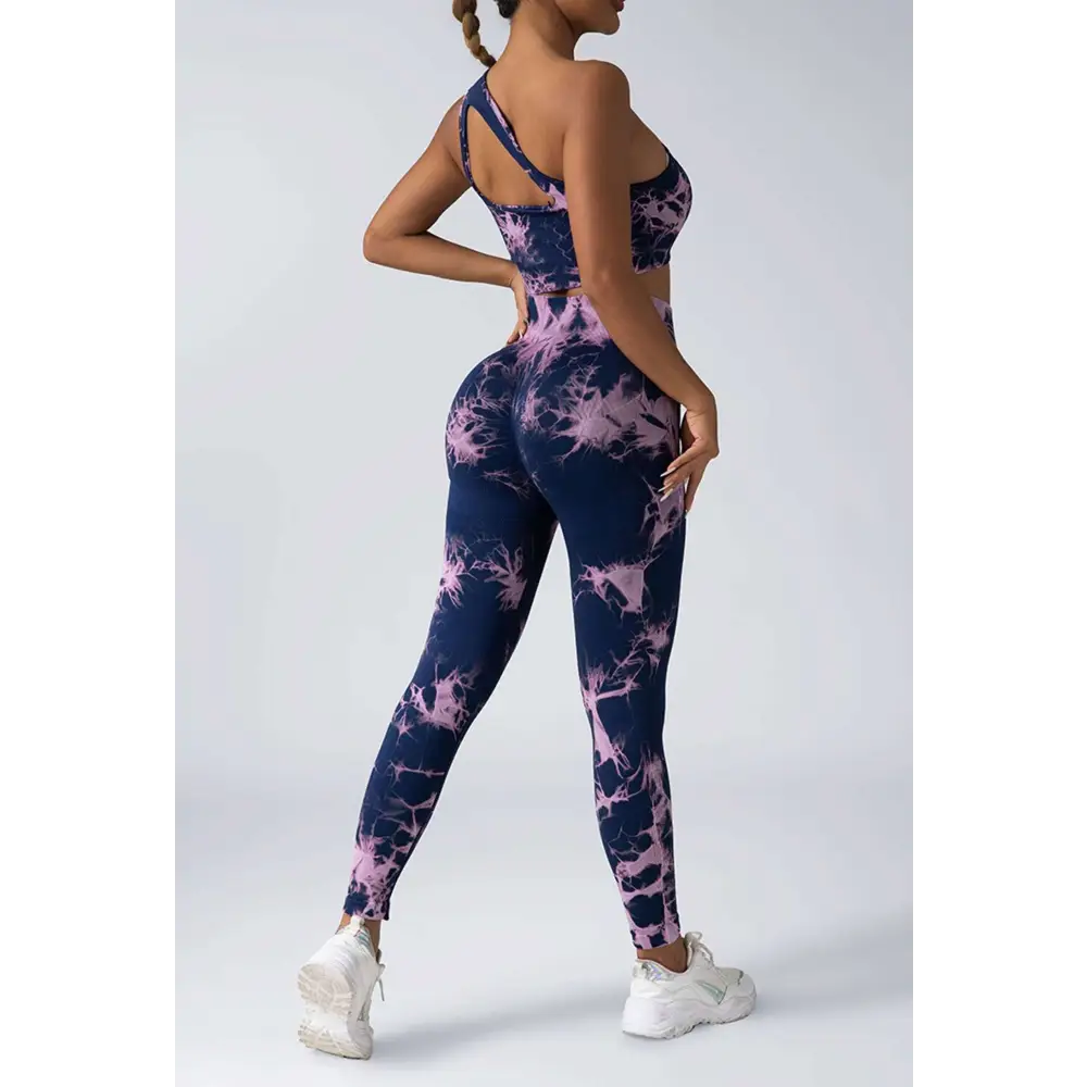 Black and white tie dye women’s scrunch butt yoga set with one-shoulder crop top and high-waisted leggings
