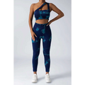 Blue and teal tie dye women’s scrunch butt yoga set with one shoulder crop top and high waisted leggings