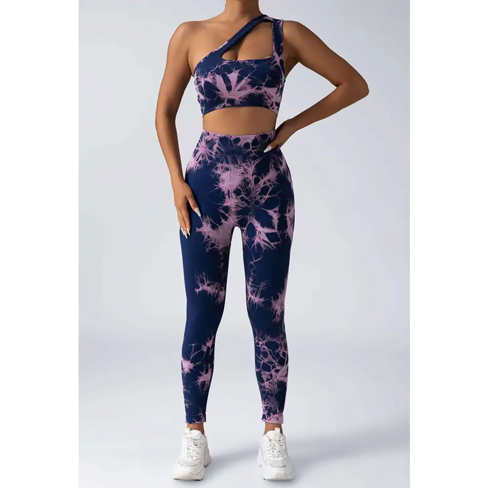 Navy blue and lavender tie dye women’s scrunch butt yoga set with one shoulder crop top and high waisted leggings