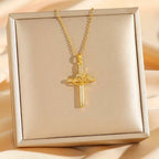 Titanium steel double ring zircon pendant necklace featuring a gold cross with heart-shaped knot and clear crystals in gift box