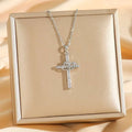 Titanium steel double cross double ring zircon pendant necklace with silver heart-shaped knot and clear crystals on beige box